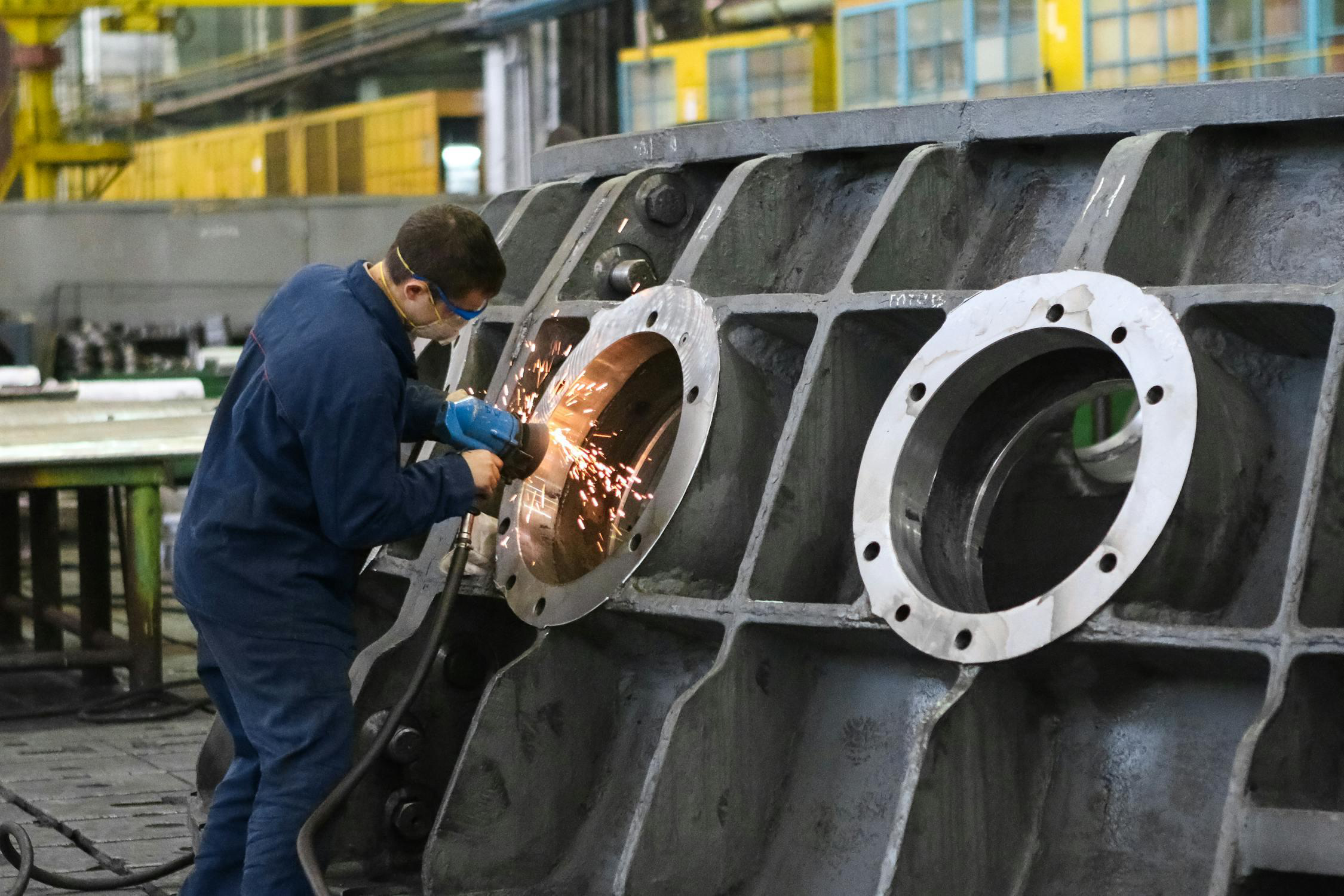 Temporary skilled laborer welding at a worksite