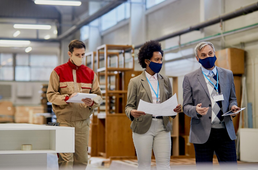 quality control inspectors walking through a facility