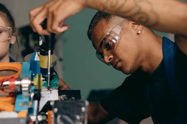 A person using a screwdriver.